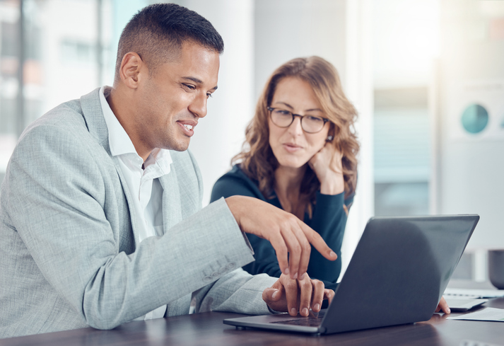 Real estate investors comparing the pros and cons of a buy-and-hold investing strategy.