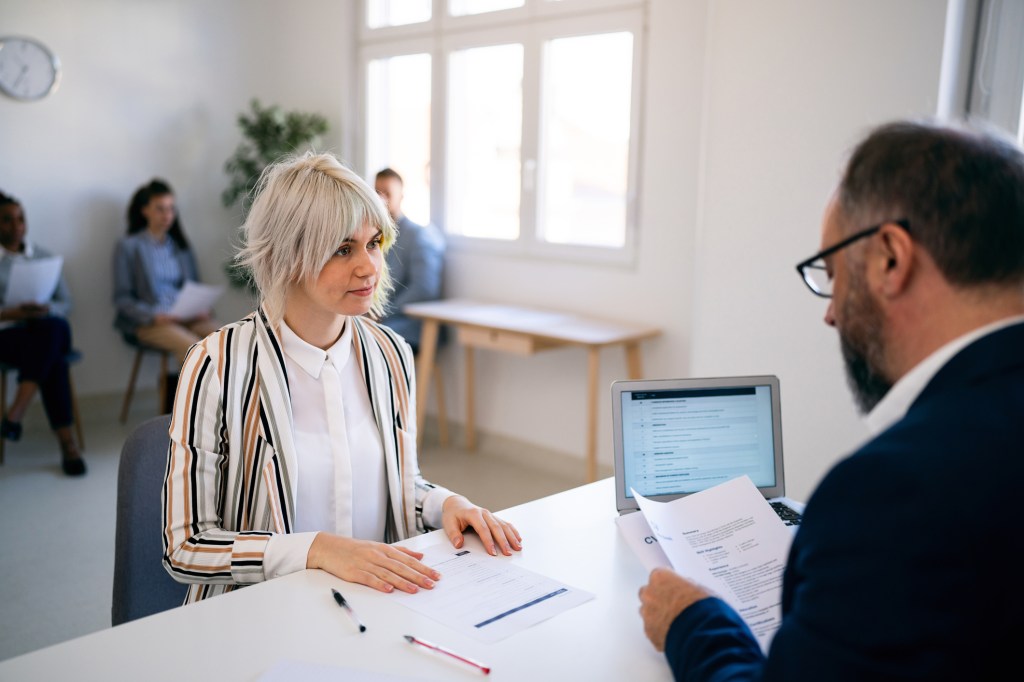 A client meeting with an advisor to discuss her financial plan to buy a home.