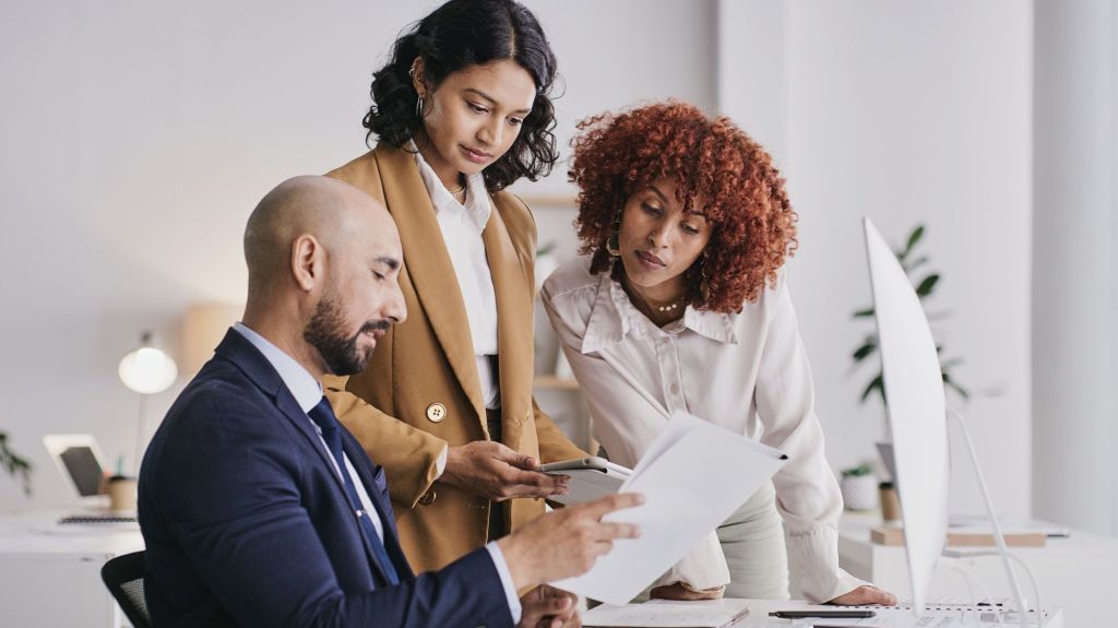 A company's financial management team discusses revenue numbers.