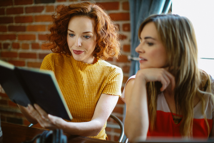 Cash dividend investors comparing their investment strategies.