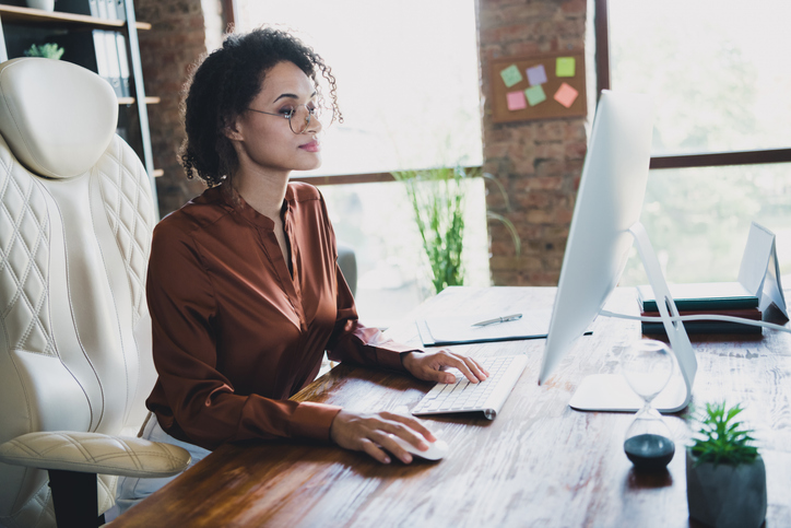 An investor researching the benefits and drawbacks of owning dividends.