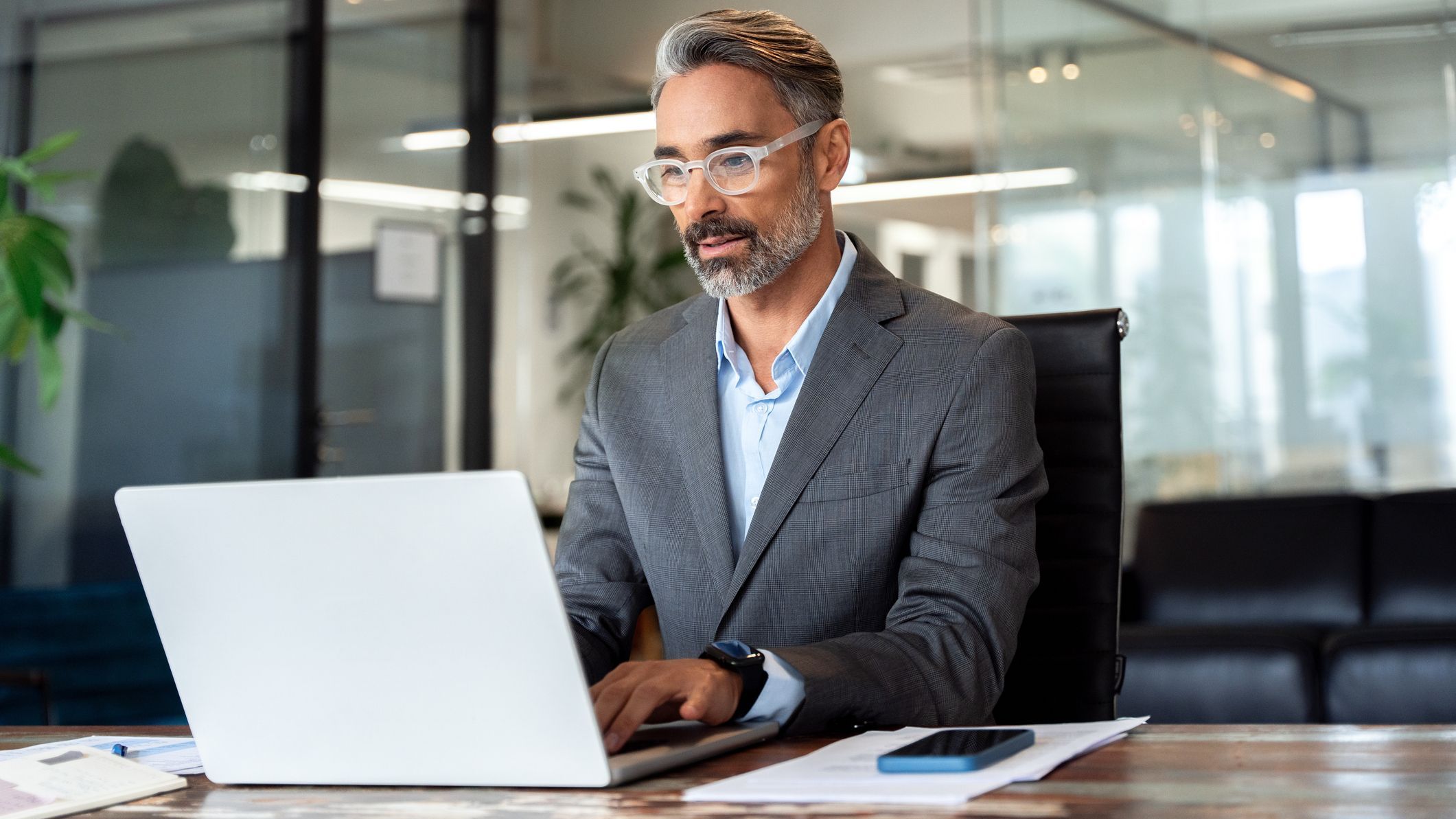 The financial manager of a company works at his desk.