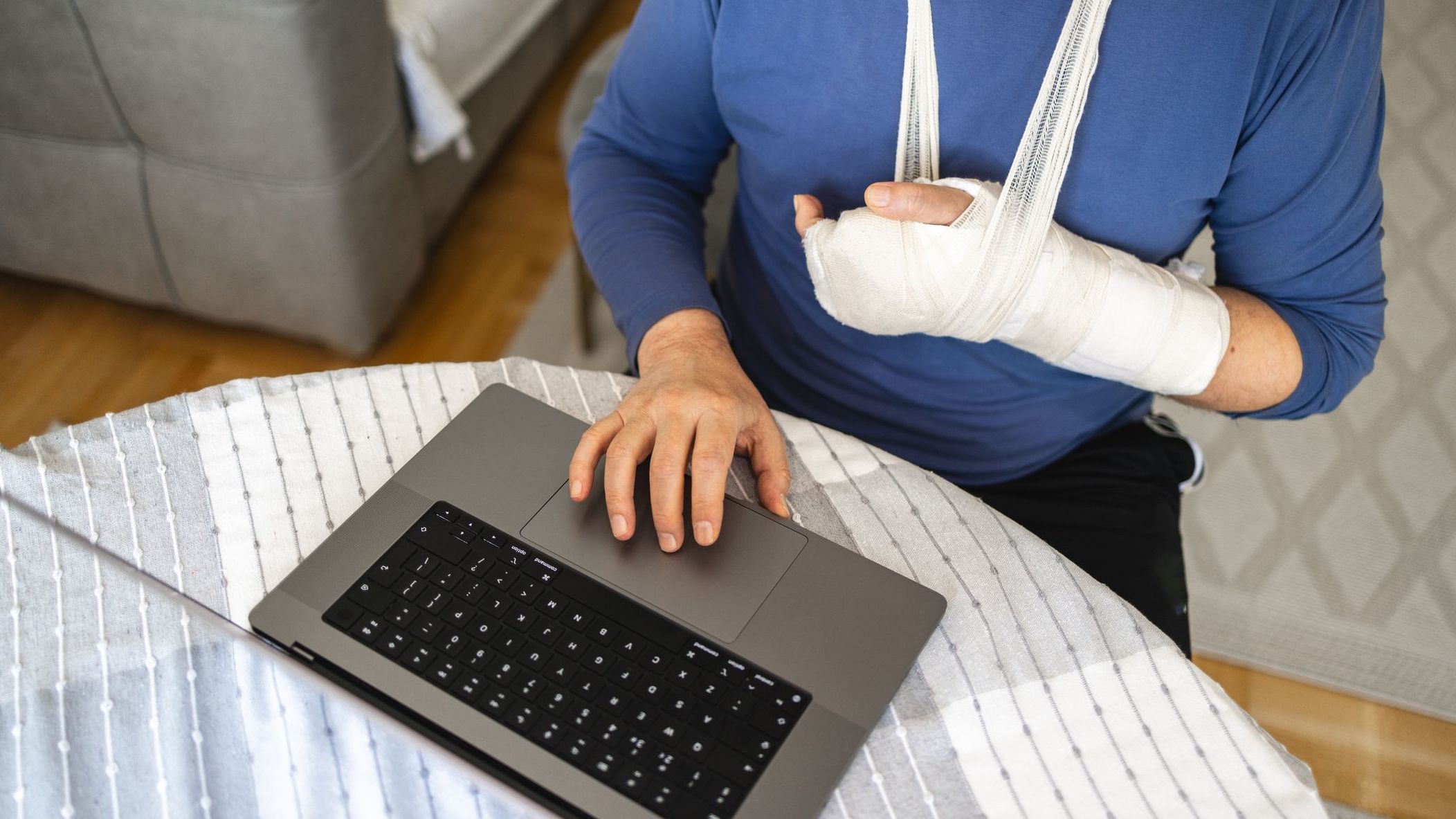 A person who's receiving worker's compensation reviews his Social Security benefits online.