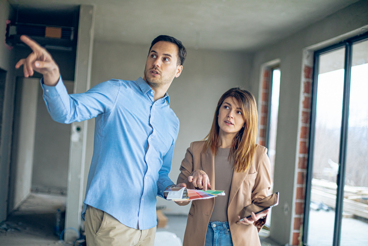 A couple choosing paint colors for a house.