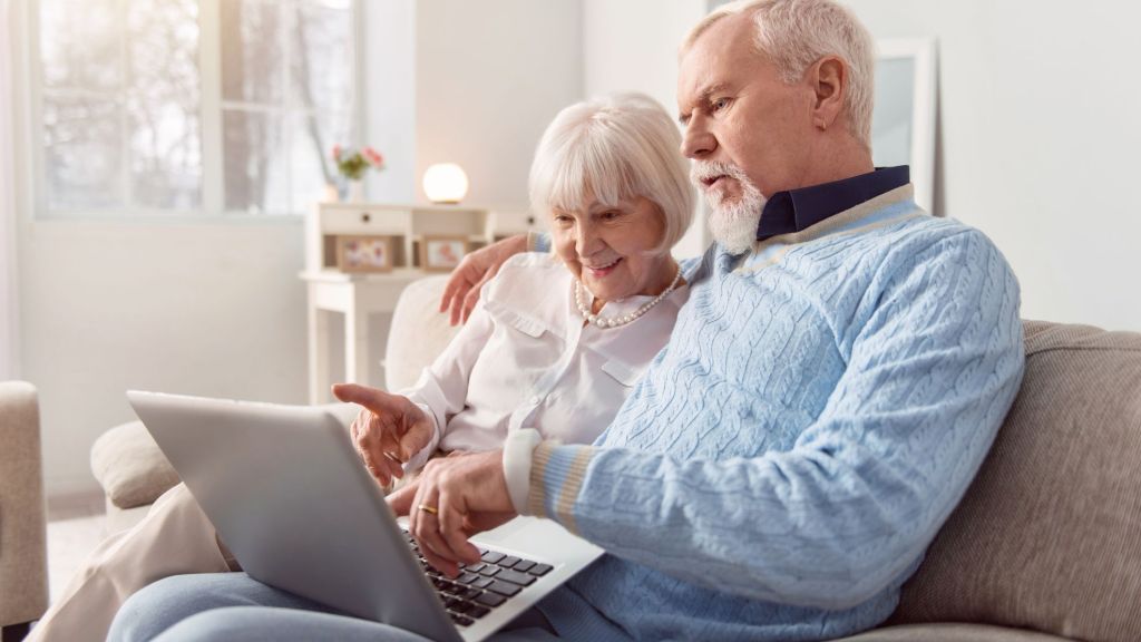 A retired couple looks over their new Social Security benefits following the most recent COLA.