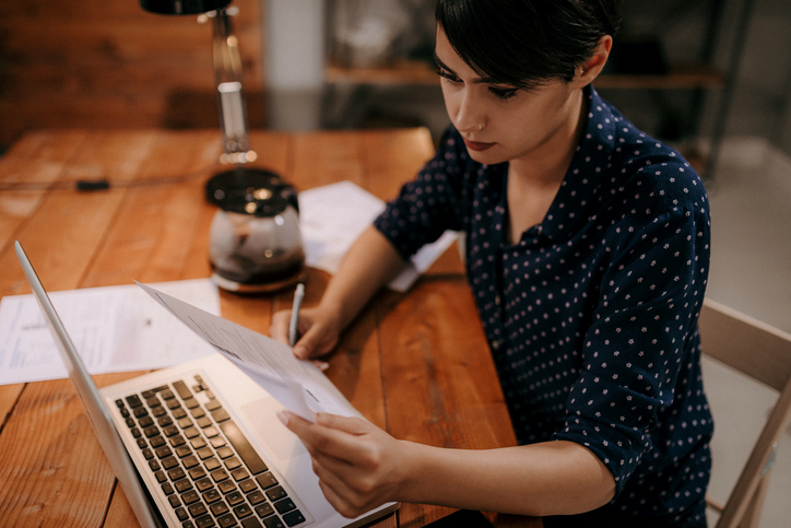 A woman determining how much she should save for retirement.