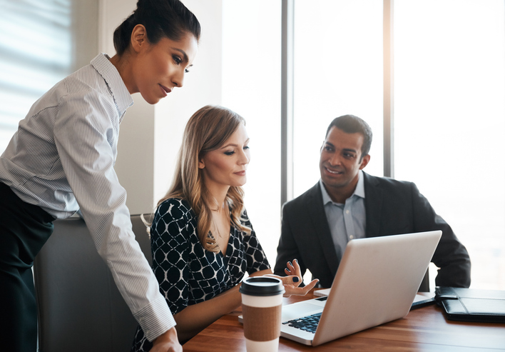 Advisors reviewing business development strategies and systems to gain more clients and increase revenues.