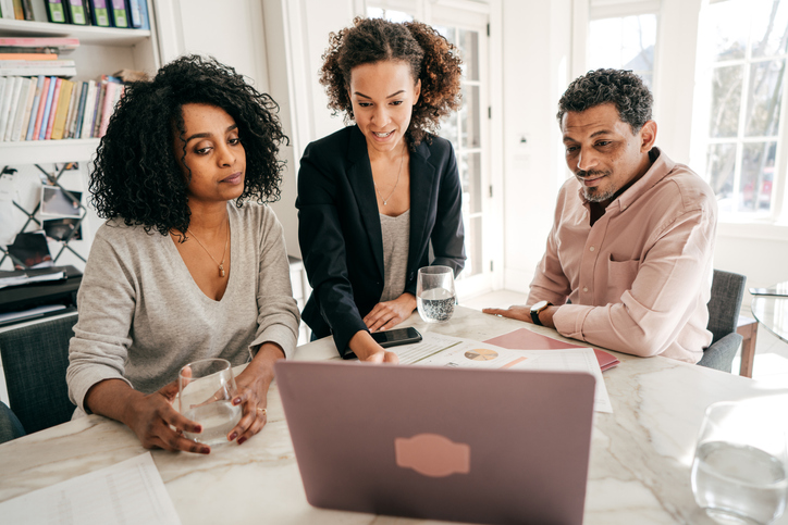 Financial advisors reviewing business development strategies.