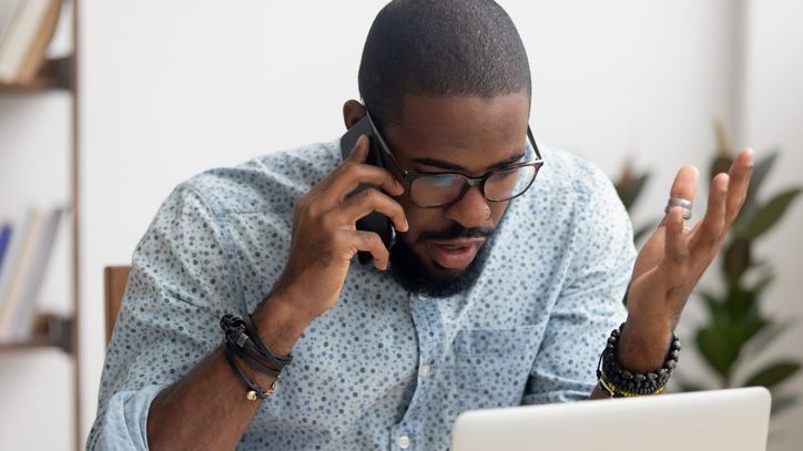 A man calls his 401(k) administrator after his company failed to deposit his salary deferral on time.