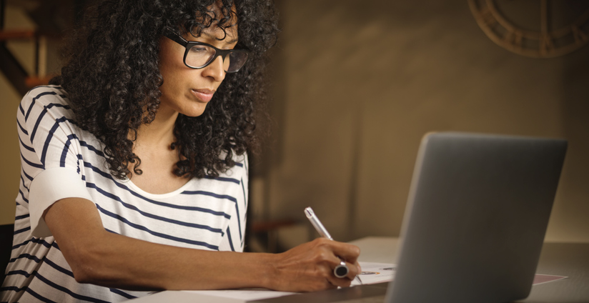 A woman reviewing her financial plan.