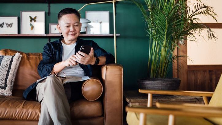 A man who recently started investing in a brokerage account looks over his portfolio.