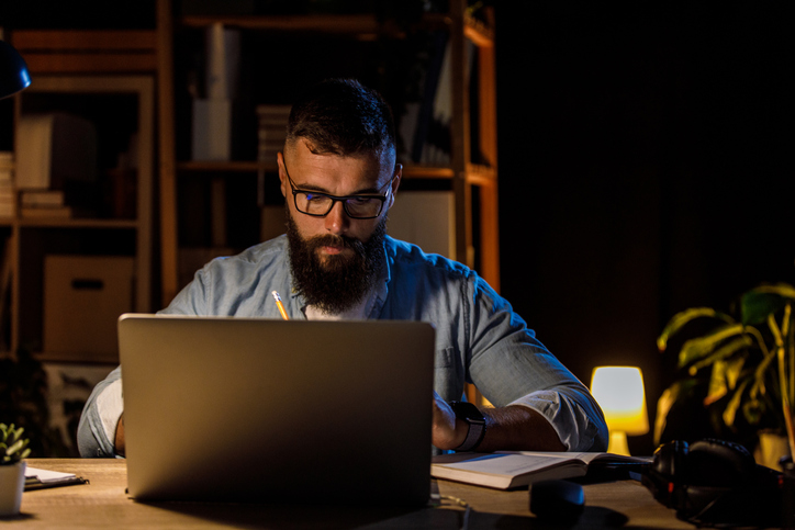 A business owner researching different types of advisor certifications.