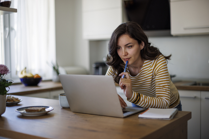 A woman researching the requirements to take out a second mortgage on a home.