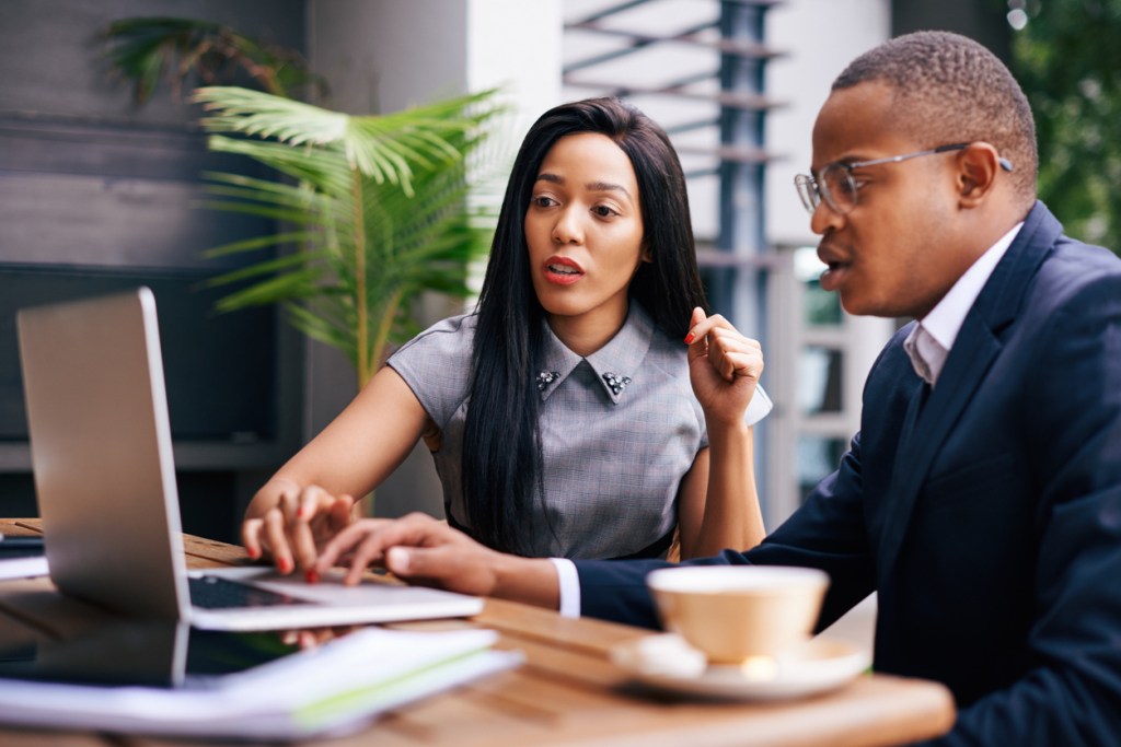 Real estate investors reviewing their portfolio.