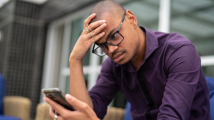 A man looks over the portfolio that his financial advisor manages for him.