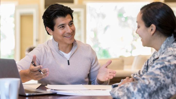A financial advisor meets with an active duty member of the military.