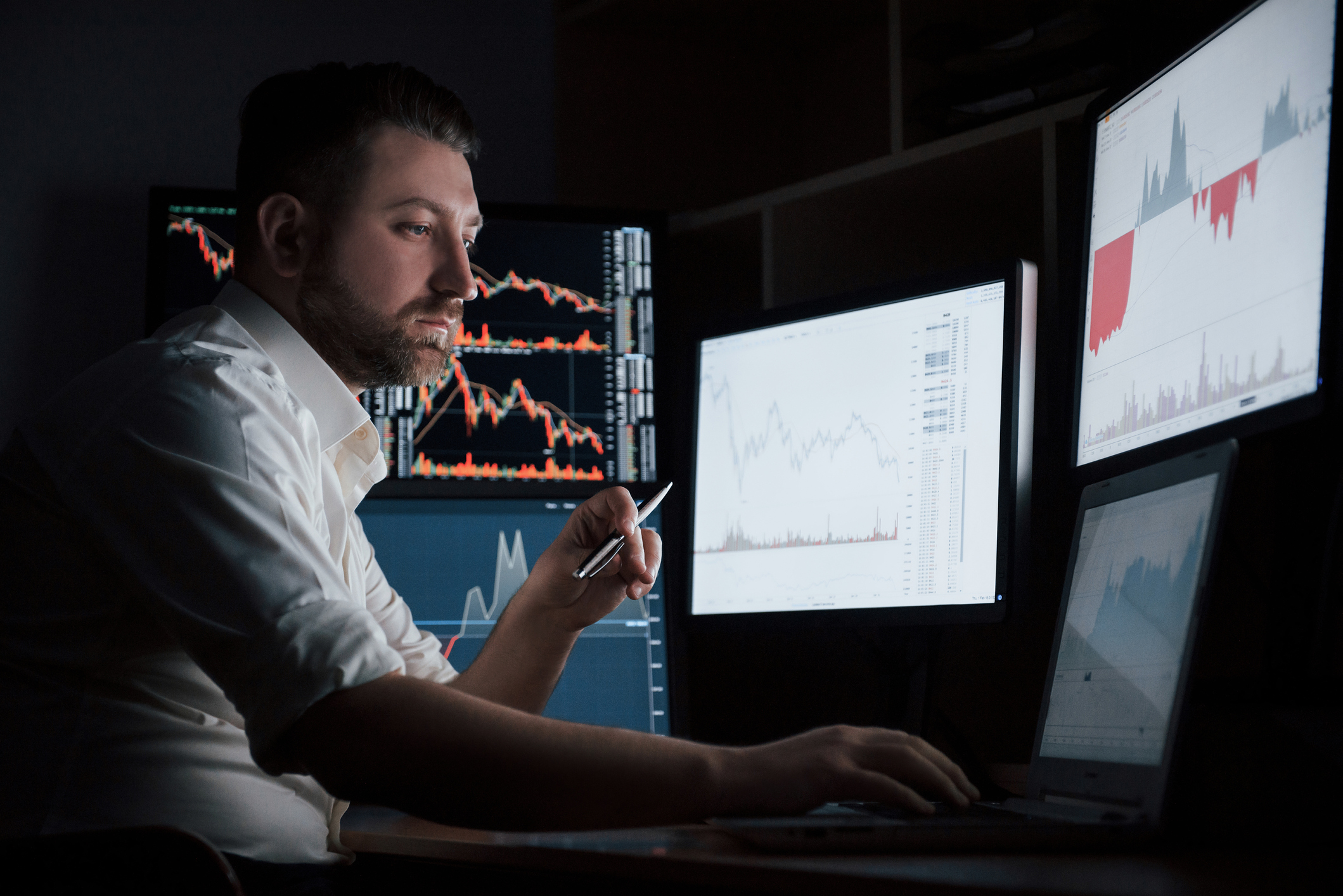 An investor analyzing data that includes historical performance, financial metrics and market trends to decide on an investment.