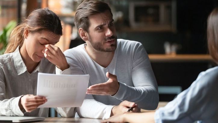 Angry clients confront their financial advisor about investment decisions that don't align with their financial goals.