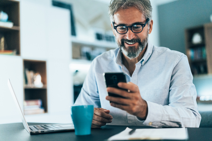 A man tracking his expenses for a financial plan.