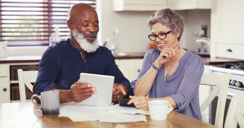 A senior couple reviewing their retirement plan.