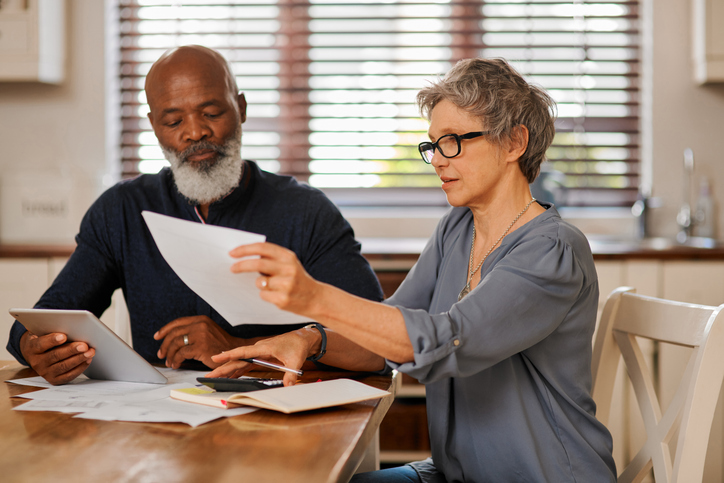 A couple reviewing their retirement savings.