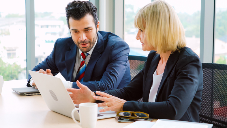 Investors reviewing an investment thesis.