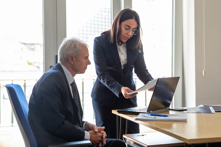Financial advisors reviewing an IUL lead strategy.