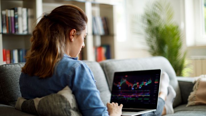 A woman tracks the price of an emerging market fund she has in her portfolio.