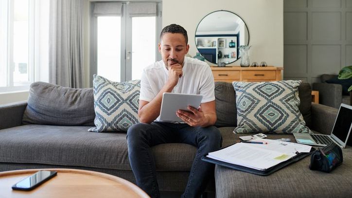 A man looks over his options for investing his emergency fund while maintaining its liquidity.
