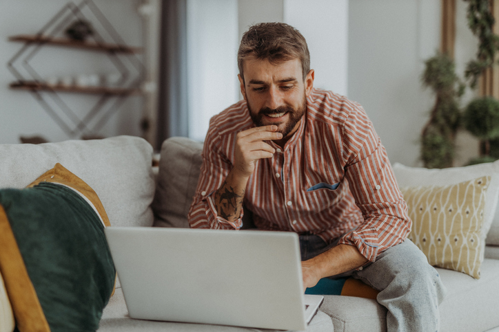 A man deciding between paying off his car loan or investing.