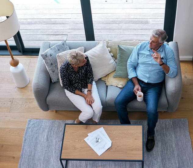 A senior couple discussing an advance healthcare directive.