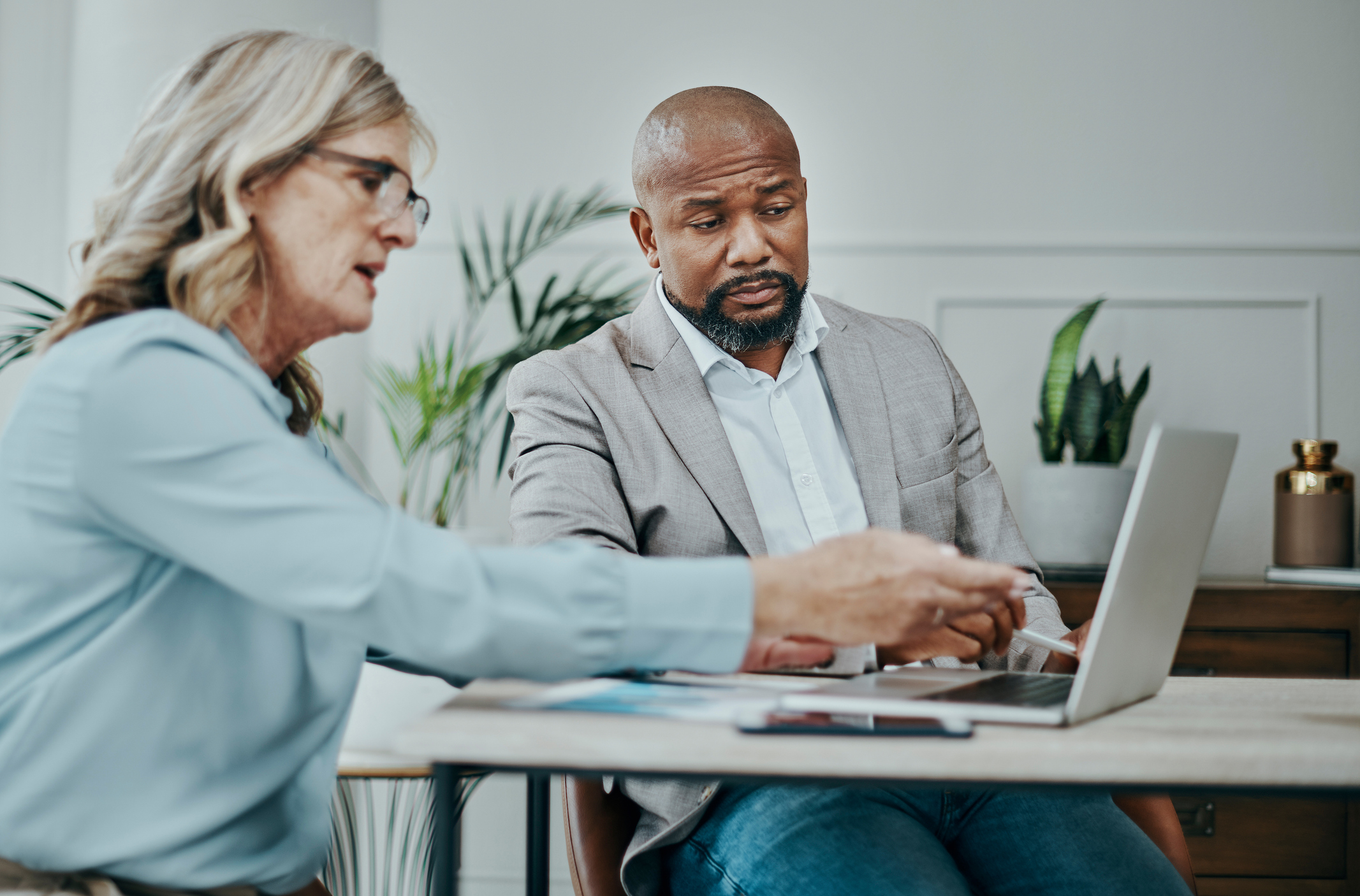 A financial advisor discussing insurance coverage for a real estate investor.