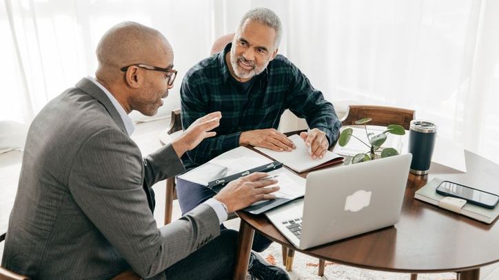 A man meets with his estate planning attorney.