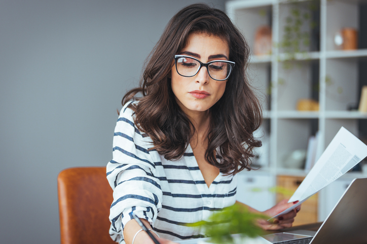 A woman estimating healthcare costs for early retirement before she can qualify for Medicare.
