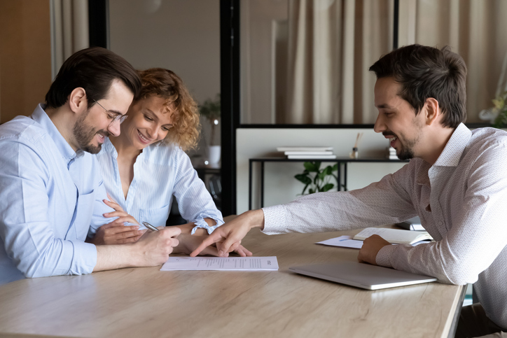 A couple creating an investment plan with a financial advisor.