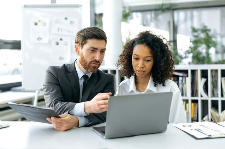 A client meeting with an advisor to determine when they should add life insurance to their retirement plan.