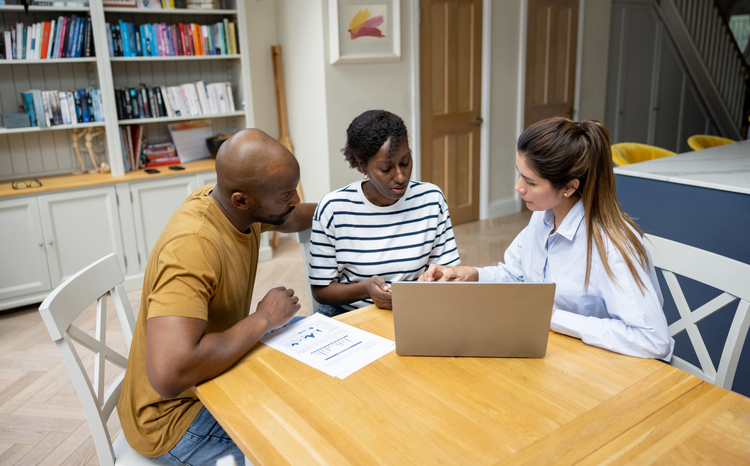 A financial advisor explaining to clients how CD investments could work for their portfolio.