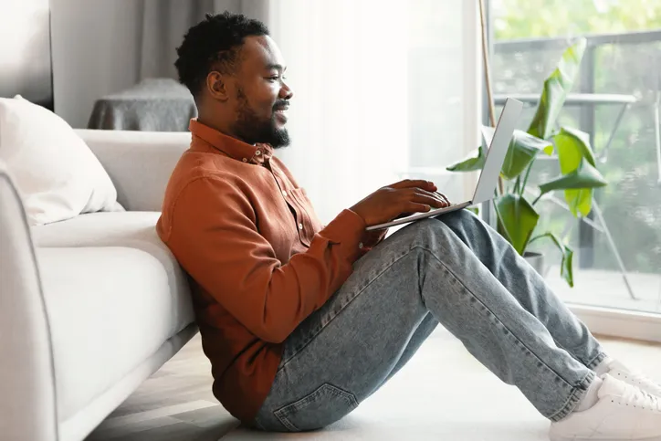 A man researching how to create a month-by-month financial plan.