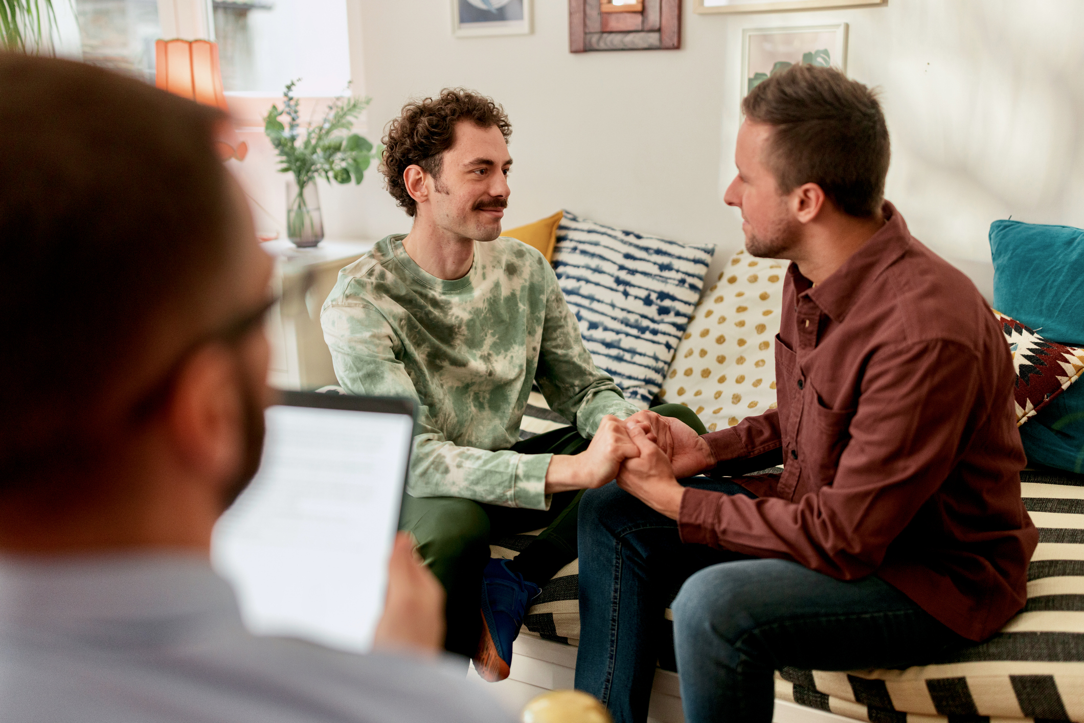 An LGBTQ couple working with an estate planning advisor.