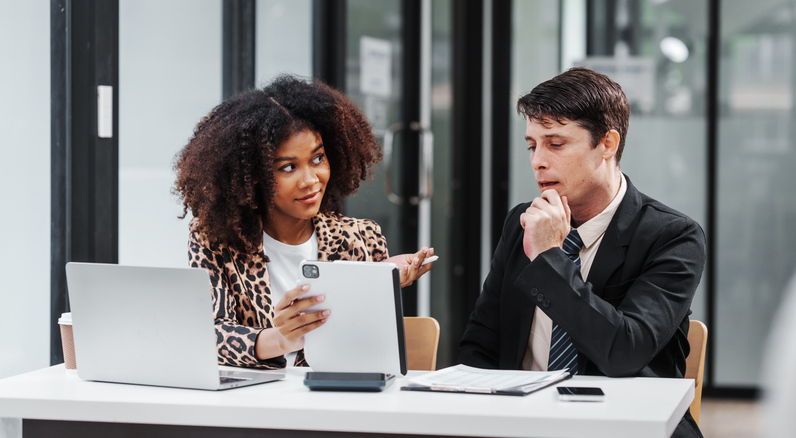 Investors researching real estate funds.