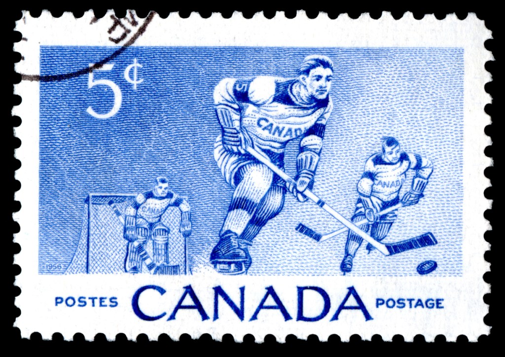Canada postage stamp showing ice hockey players.