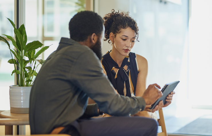 A financial advisor working with a client to set financial milestones.