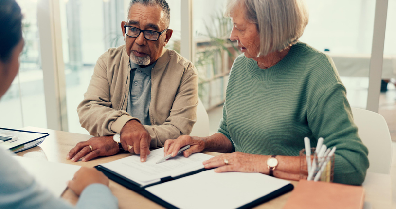A senior couple reviews an advance healthcare directive (AHD) in Maryland.