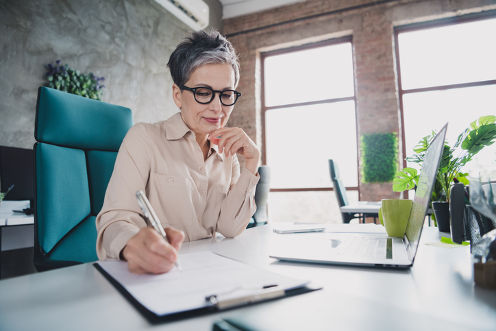 A woman reviewing her eligibility for healthcare coverage.