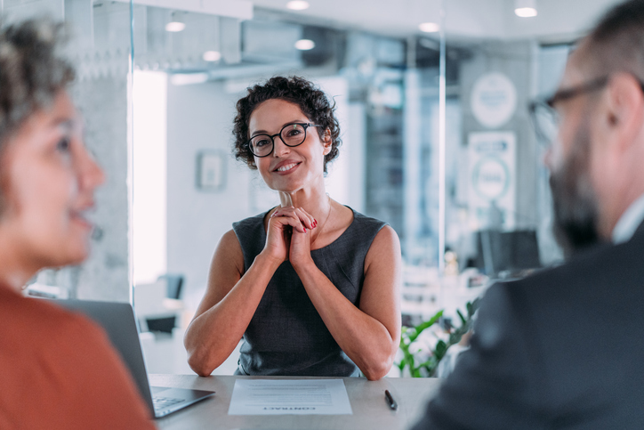 A financial advisor explaining to clients how to add bonds to their portfolio.