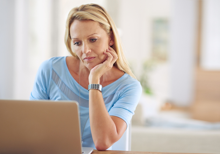 A woman researching early retirement tax strategies.