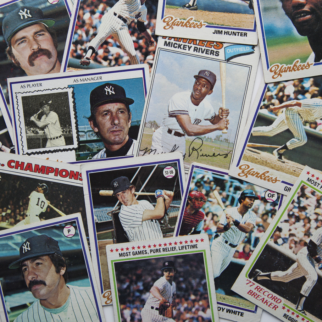 A pile of vintage baseball cards from the 1970s New York Yankees.