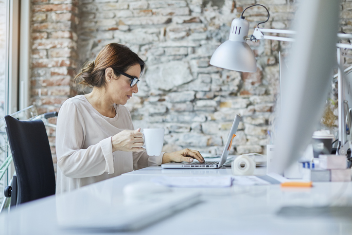A woman looking up her healthcare benefits.