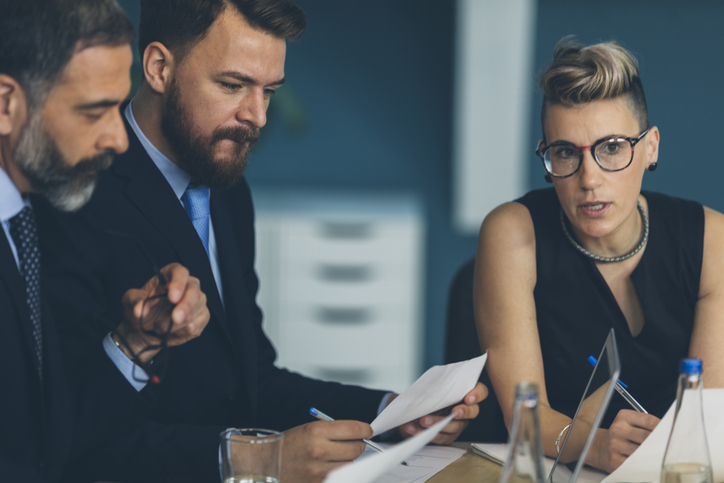 Investors reviewing preferred stock and high-yield bond investments.