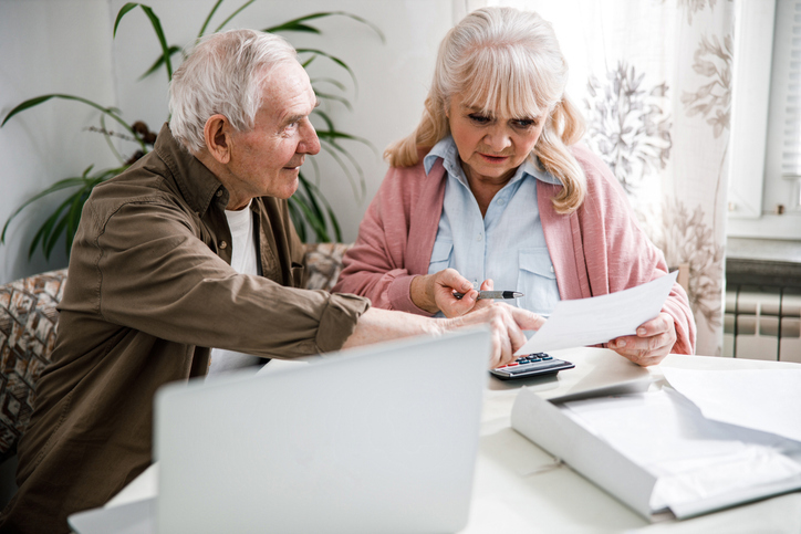 A senior couple researching ways to avoid probate.